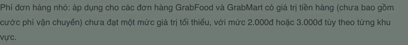 Vietnamese paragraph on a dark green background describing the small-order fee for GrabFood and GrabMart orders