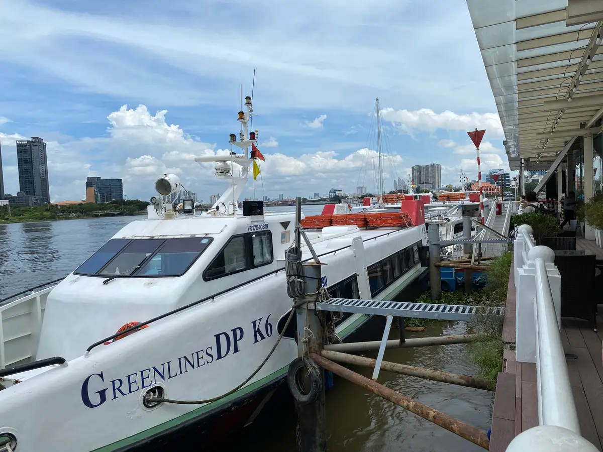 White Greenlines ferry moored beside a covered pontoon walkway
